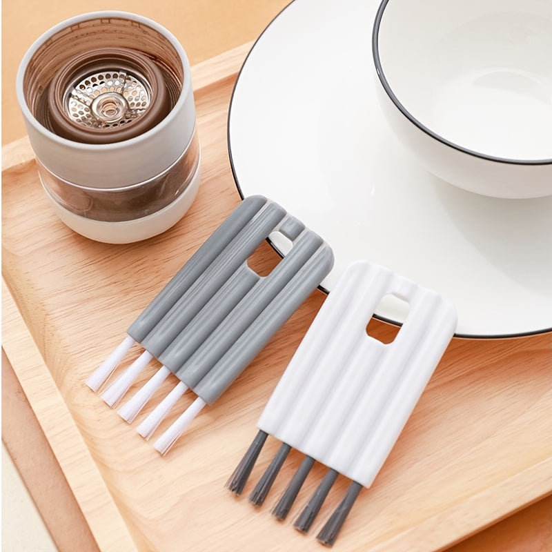 Set of gray and white straws on a wooden tray with a ceramic cup and saucer in the background.