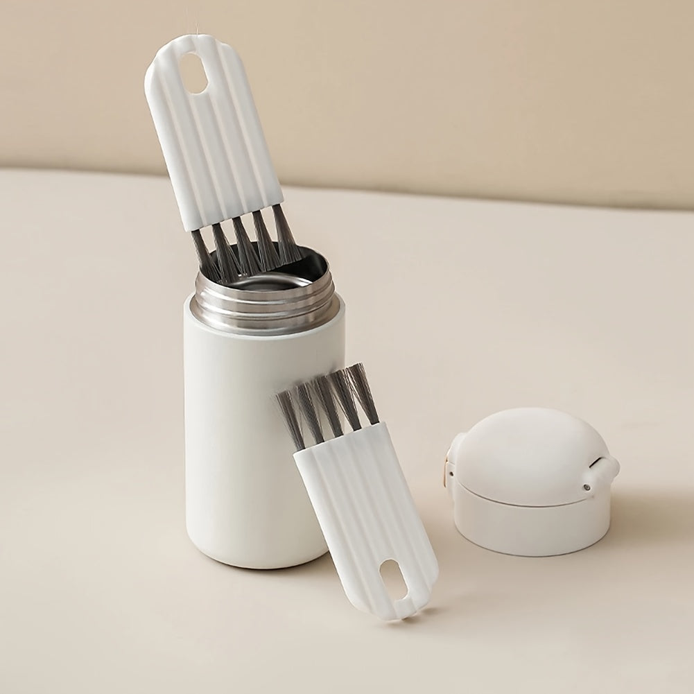 Set of white kitchen brushes with a container on a beige surface