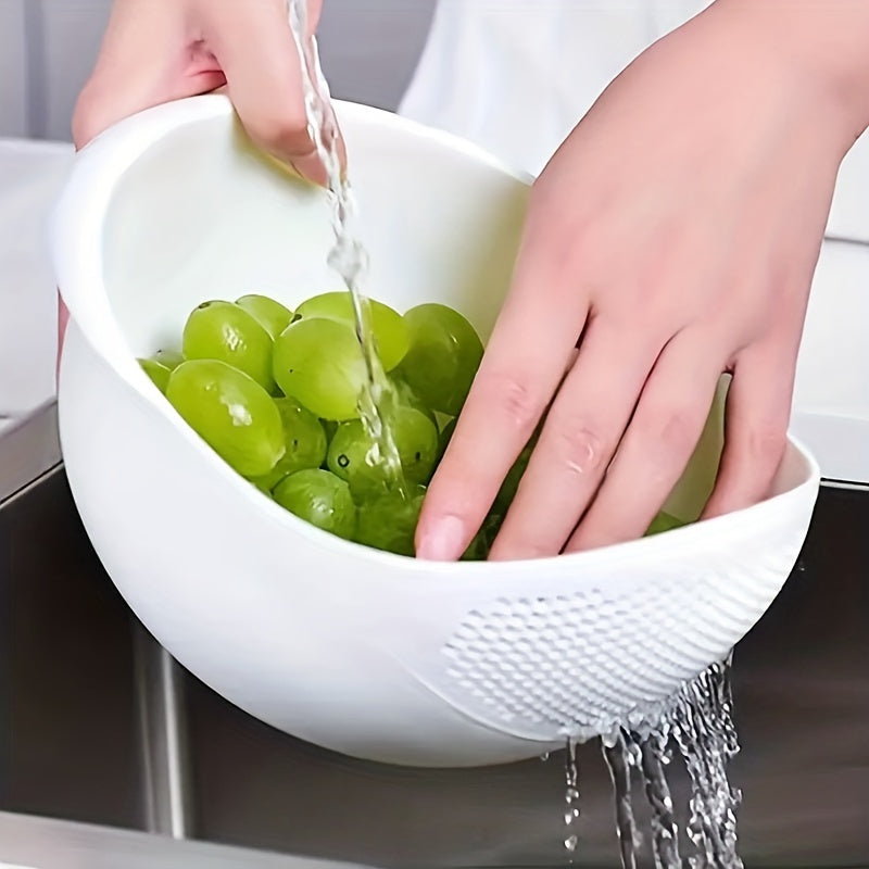 Person washing green grapes in a white colander under running water.