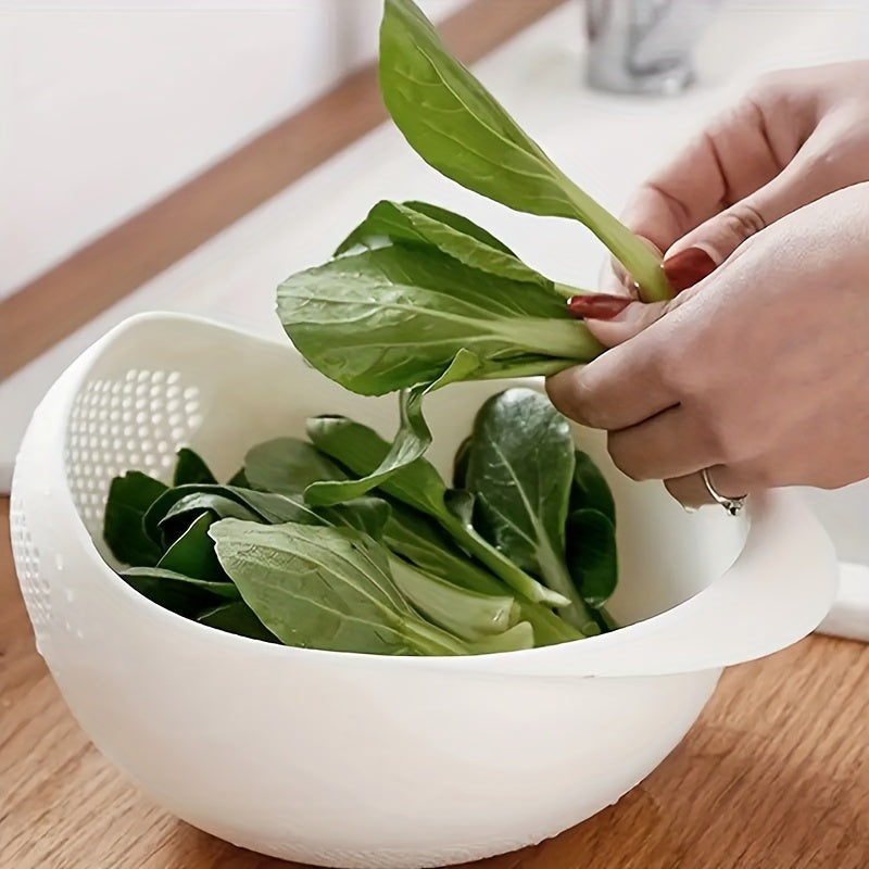 Person adding green leafy vegetables into a white colander on a wooden surface.