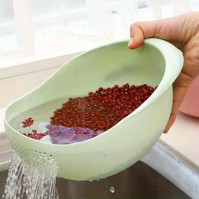 Person holding a green colander with red beans being rinsed under running water.
