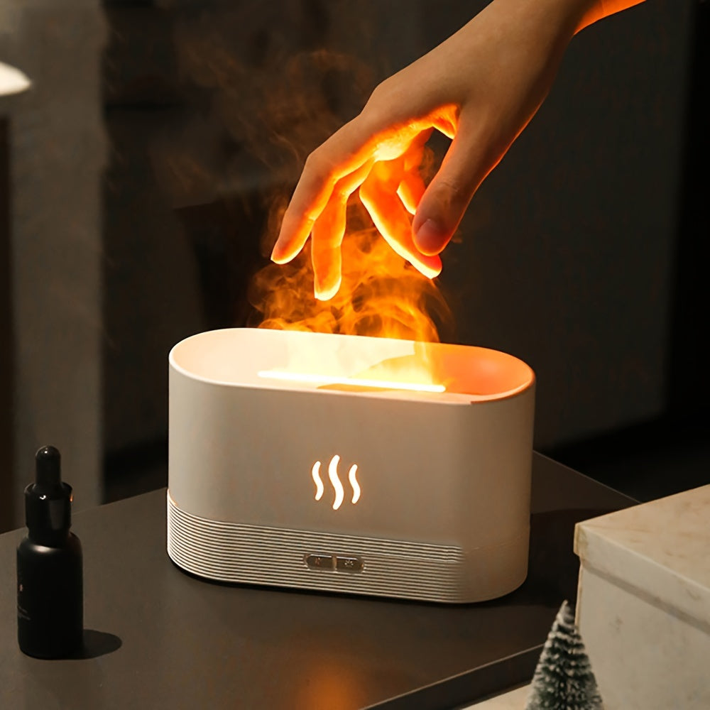 Hand interacting with a flame-emitting device on a dark surface, with a bottle and small tree nearby.