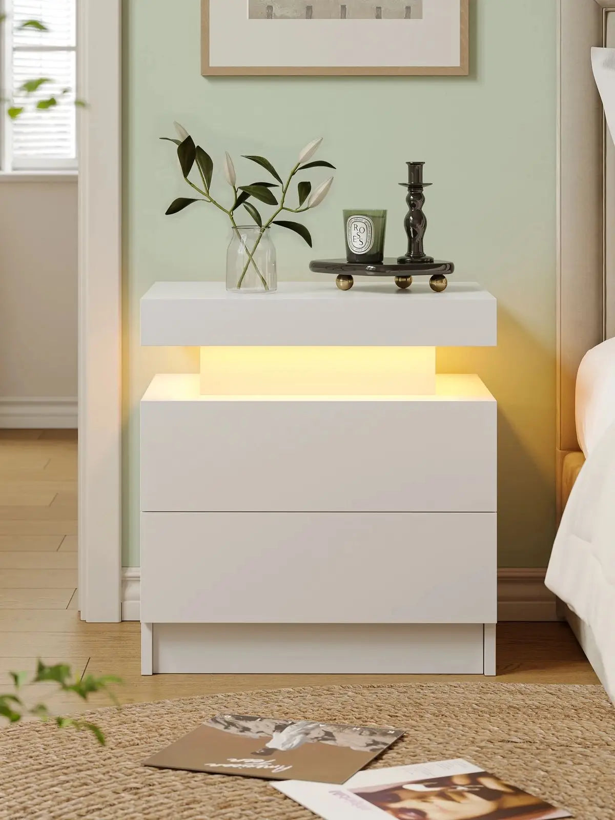 White nightstand with LED lighting in a bedroom setting