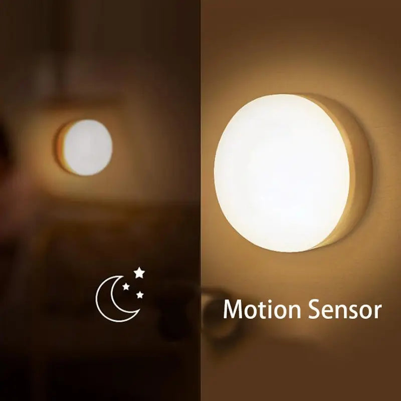 Round motion sensor light with glowing white light on a dark background