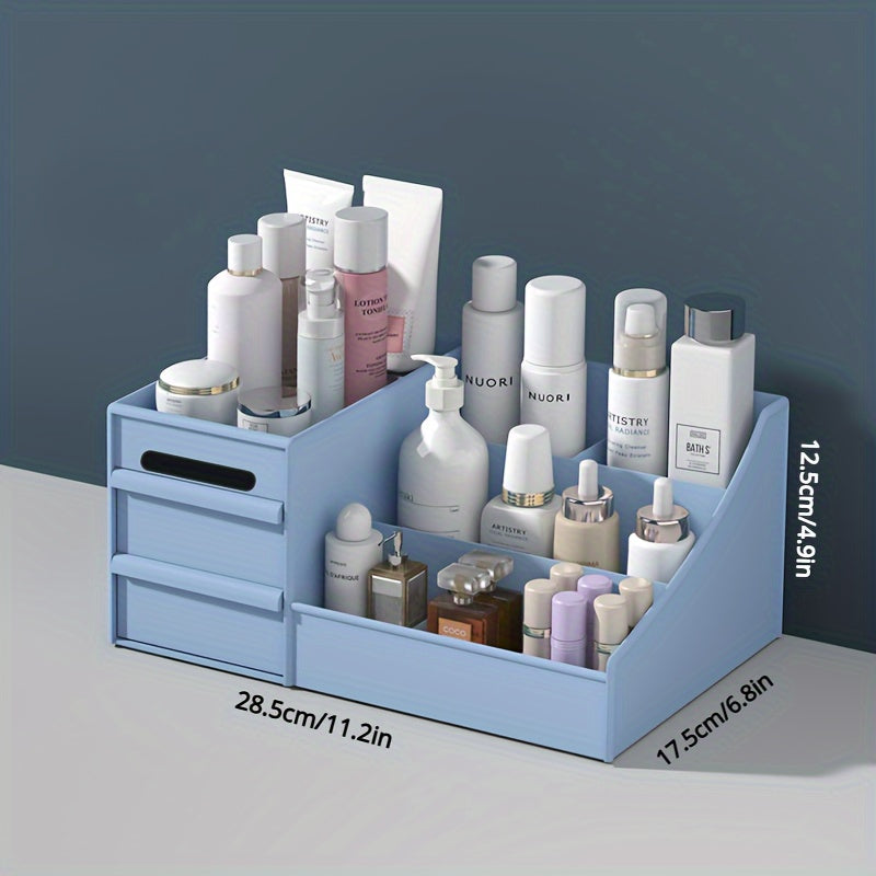Blue cosmetic organizer with various skincare products on a gray surface and dark blue background