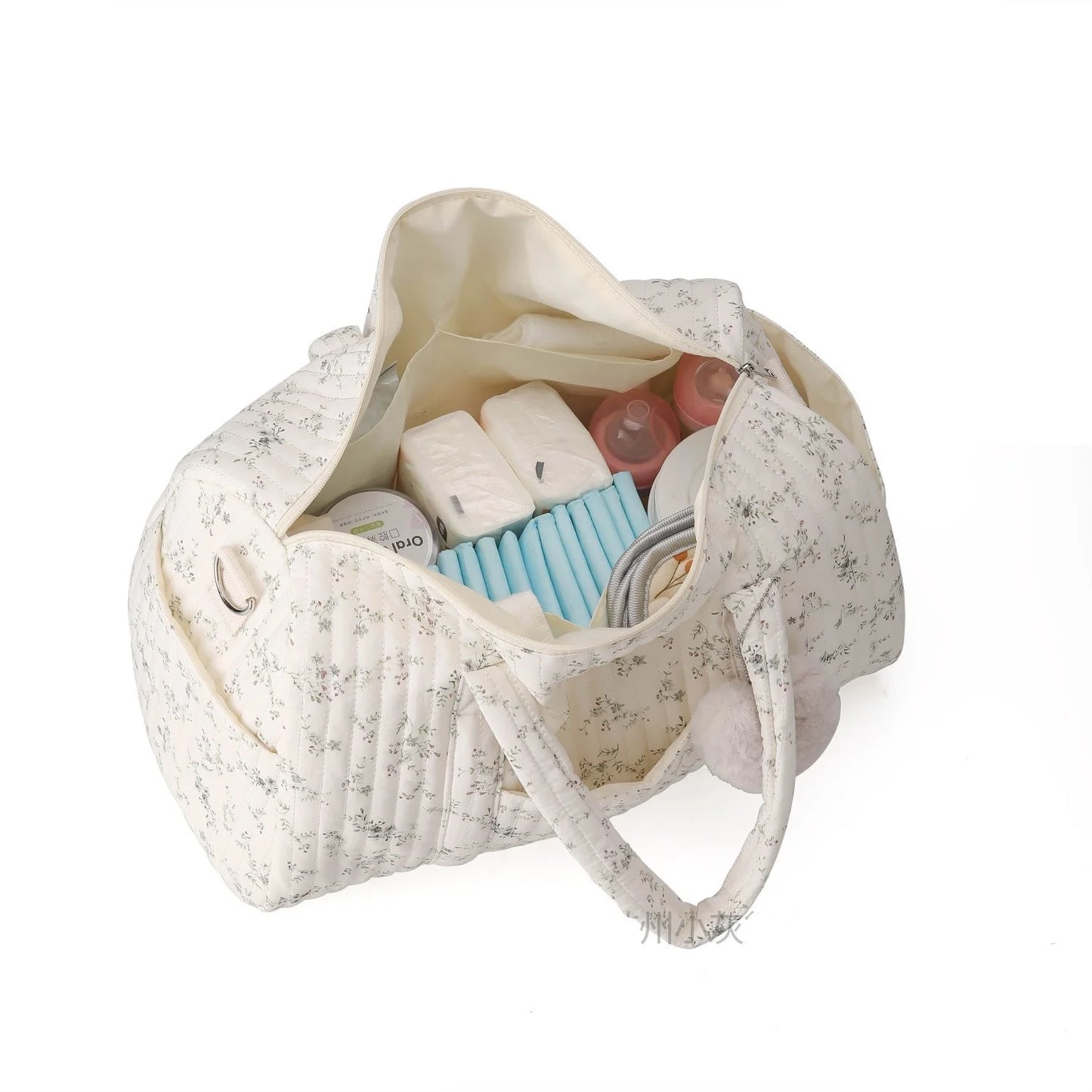 Floral-patterned bag with toiletries on a white background