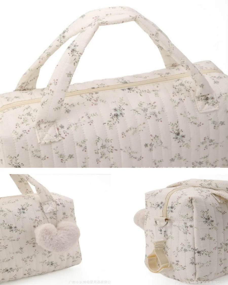 Floral-patterned duffel bag on a white background