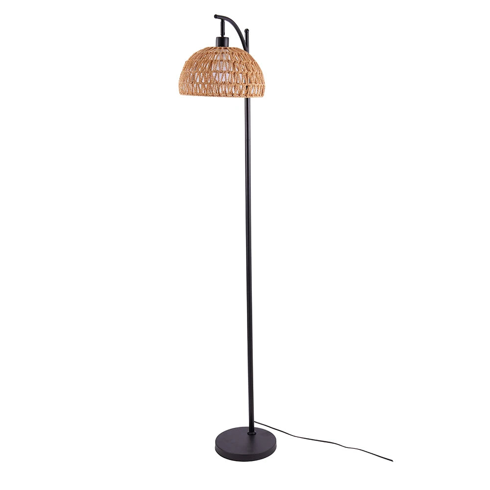 Floor lamp with a wicker shade on a white background