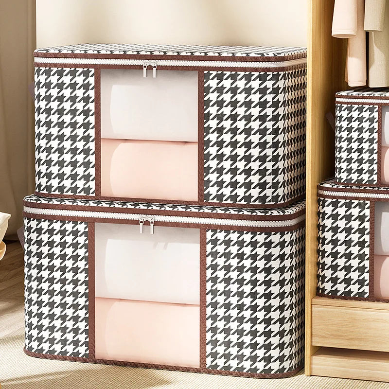 Houndstooth patterned storage boxes with white interior compartments on a wooden shelf.