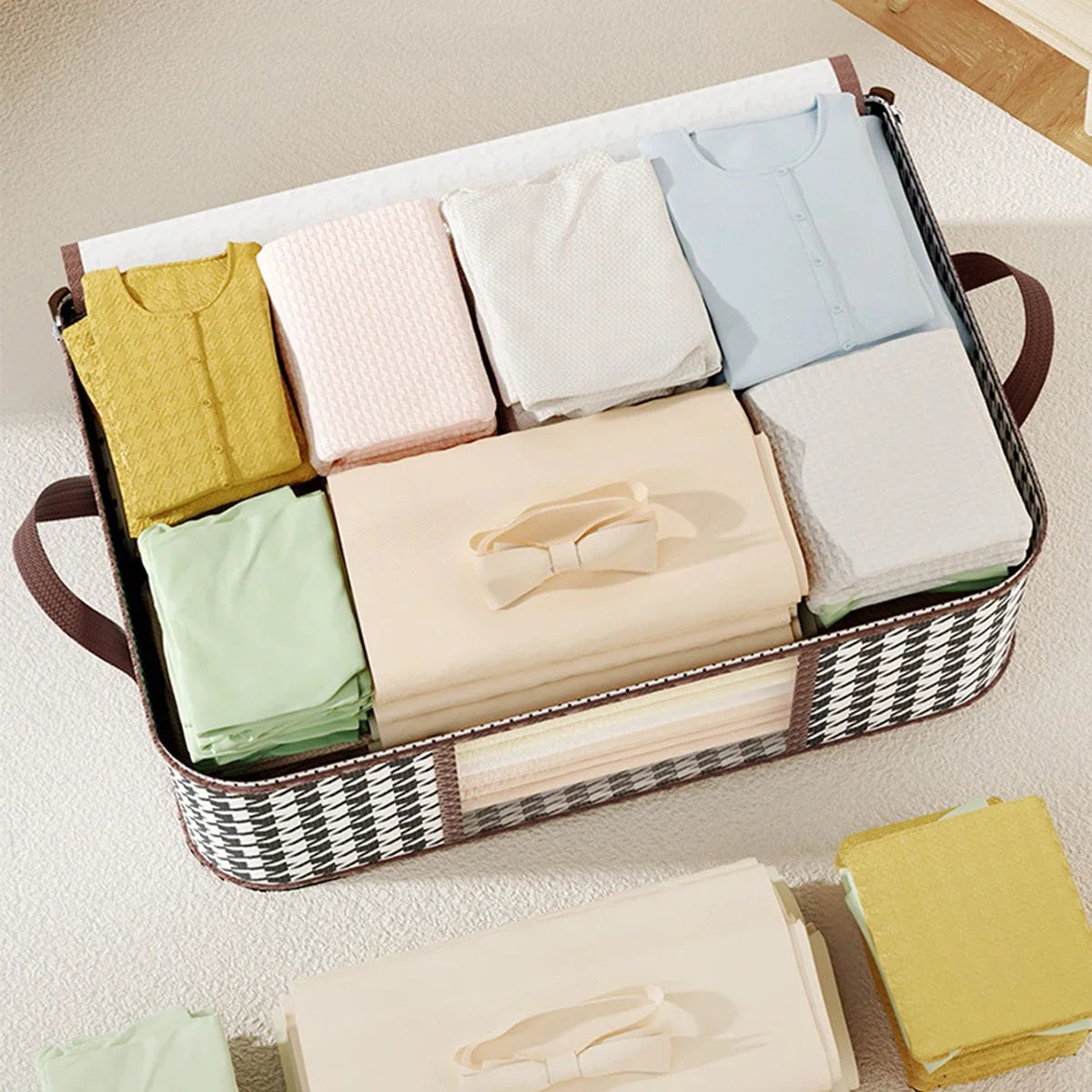Folded clothes in a woven storage basket on a light surface