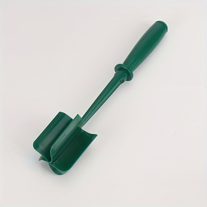 Green gardening tool on a white background