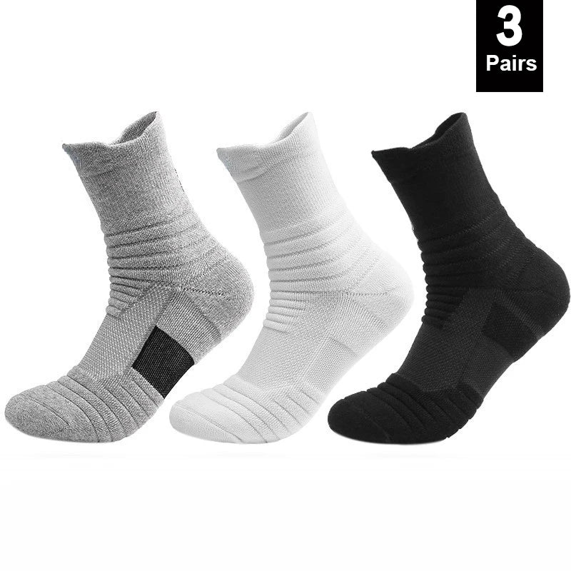 Three pairs of socks in gray, white, and black on a white background