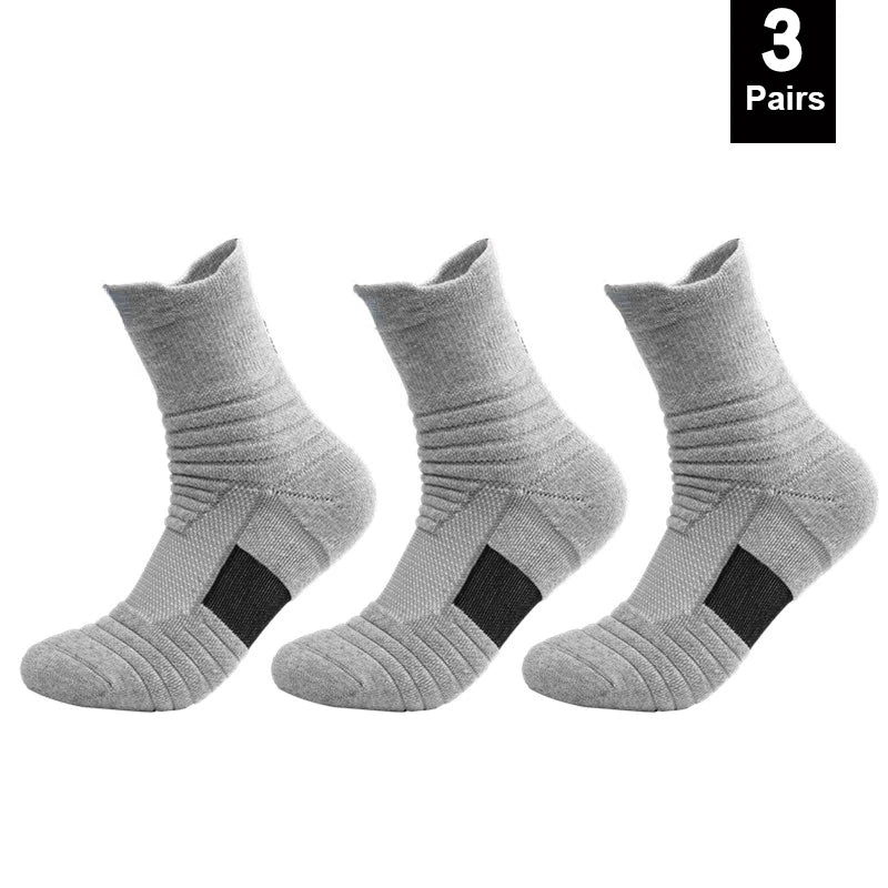 Three pairs of gray socks with black accents on a white background