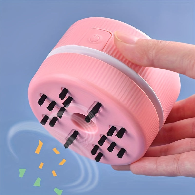 Pink handheld device with a hand holding it against a blue background