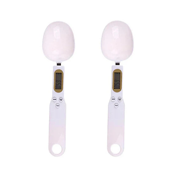 Two digital egg scales with white eggs on a white background