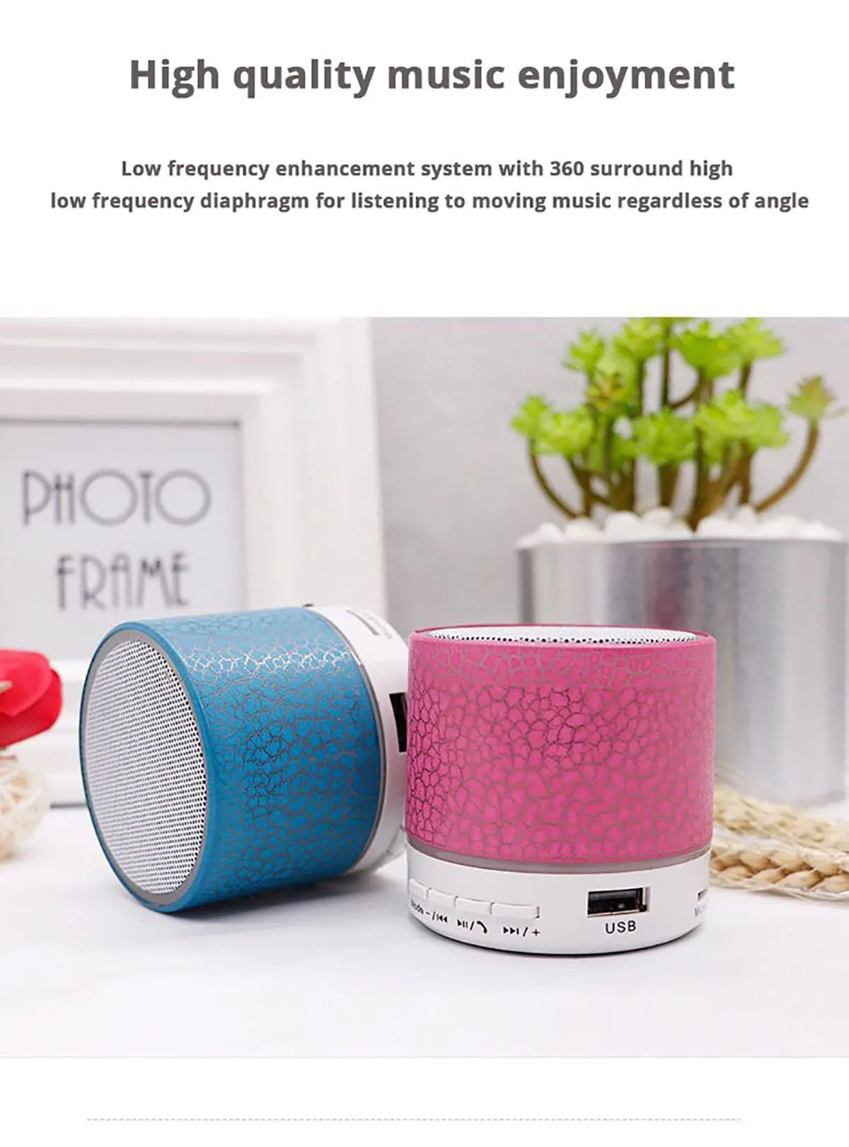 Blue and pink Bluetooth speakers on a white surface with text about music enjoyment.