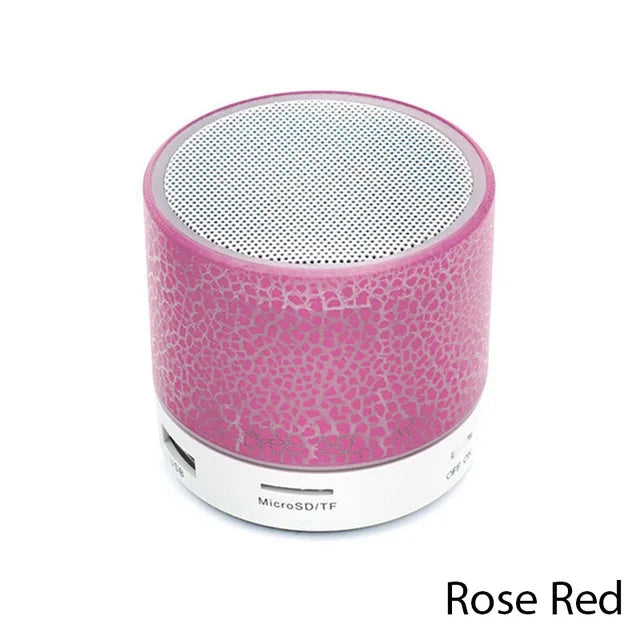 Rose red portable speaker on a white background
