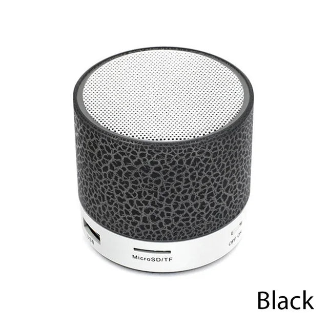 Black and white portable speaker on a white background