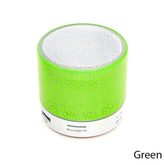 Green portable speaker on a white background
