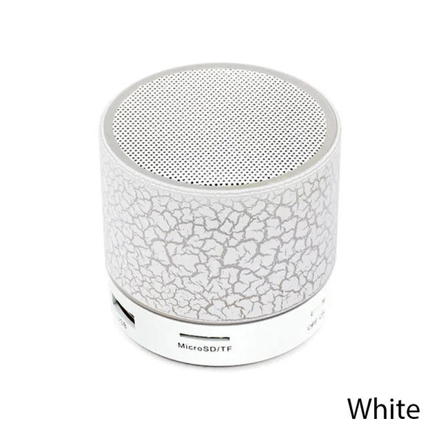 White portable speaker with crumpled paper texture on a white background