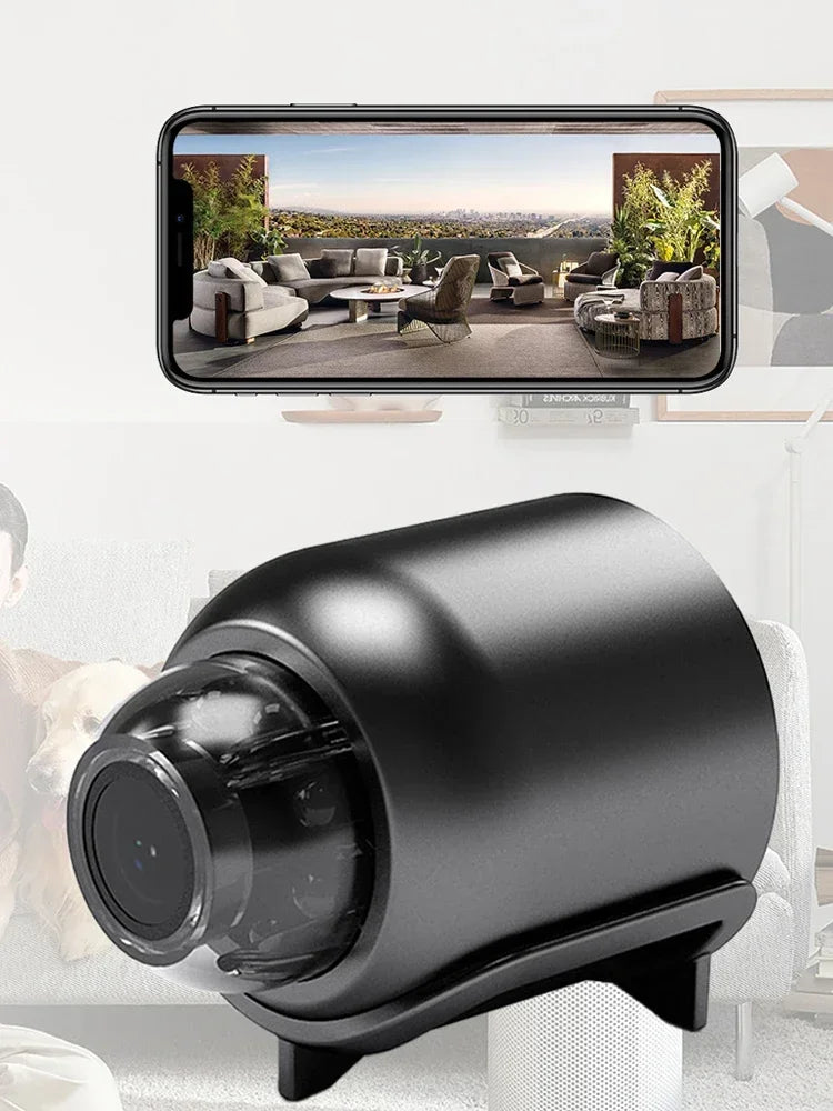 Black camera device with a smartphone displaying an outdoor scene.