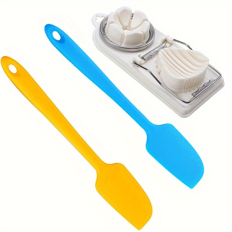 Two spatulas, one yellow and one blue, with a kitchen tool on a white background.