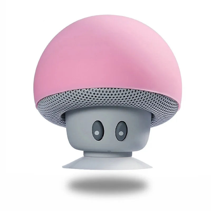 Mushroom-shaped speaker with pink top and gray bottom on a white background