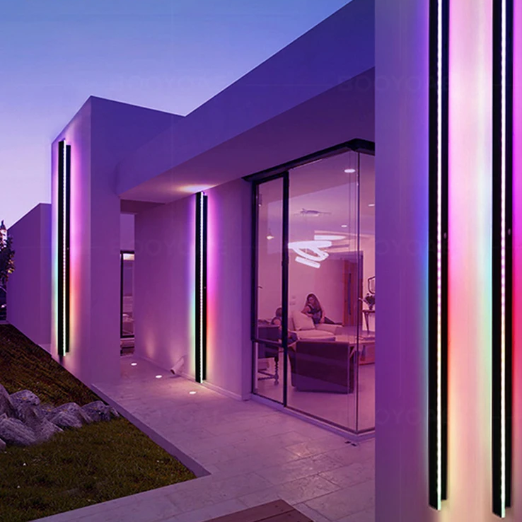 Modern house exterior with RGB outdoor lighting at dusk