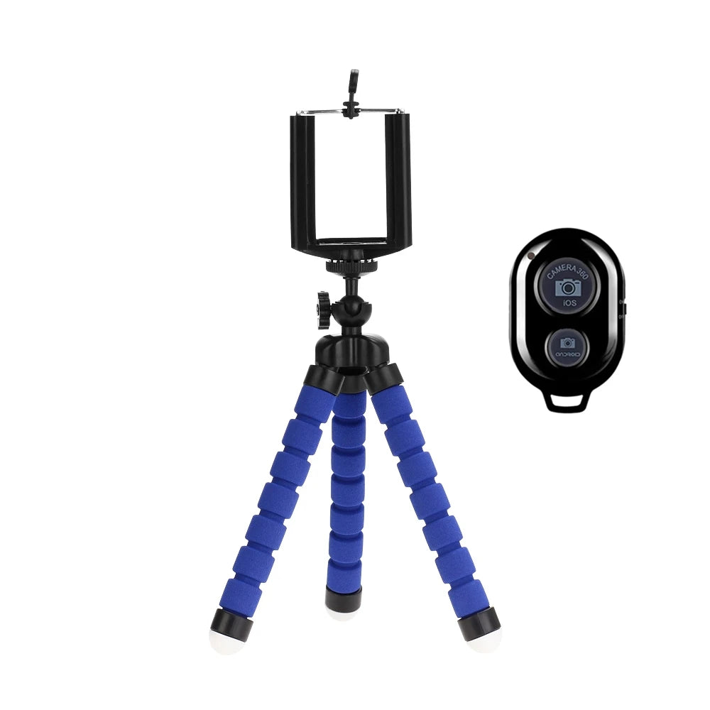 Blue flexible tripod with smartphone holder and remote control on a white background