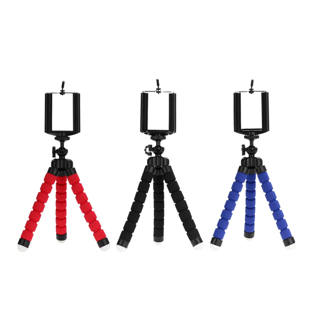 Three flexible tripod stands with red, black, and blue legs on a white background
