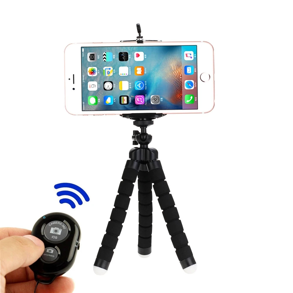 Smartphone on a flexible tripod with remote control on a white background