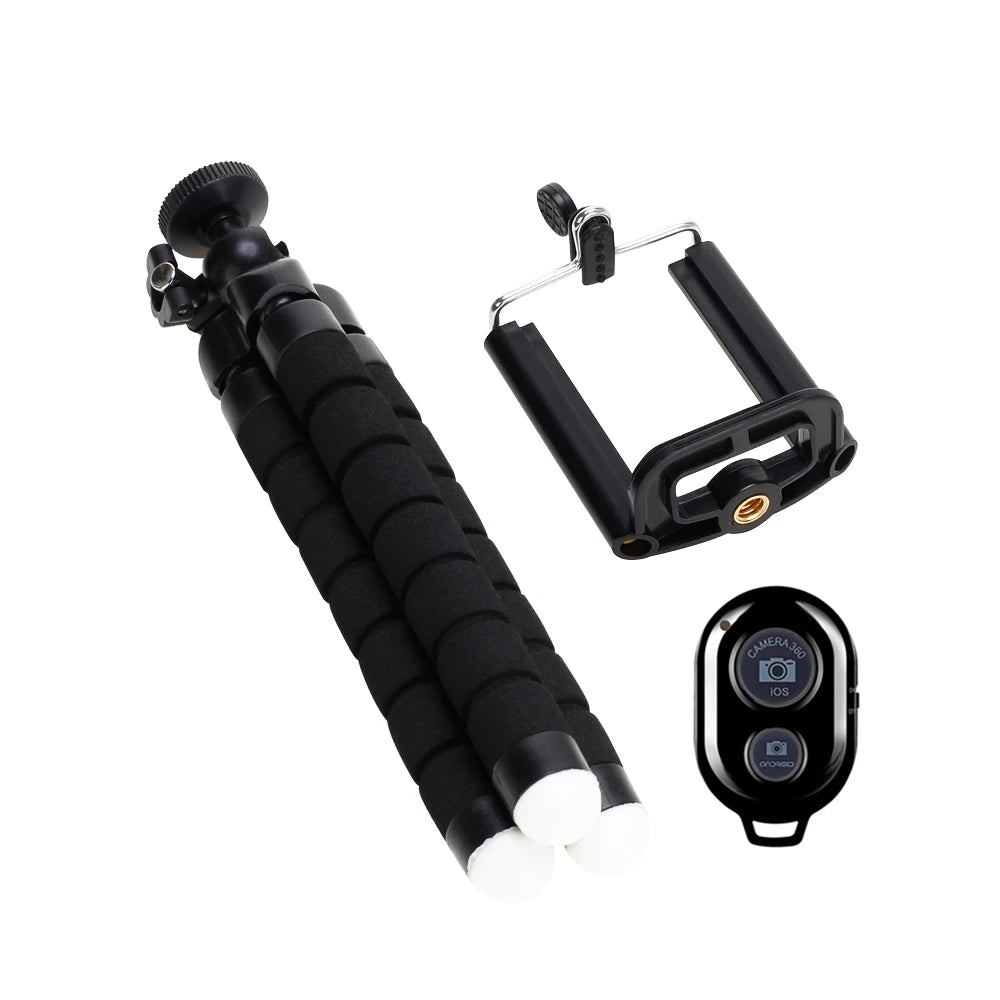 Black camera accessory set with monopod, phone holder, and remote control on a white background