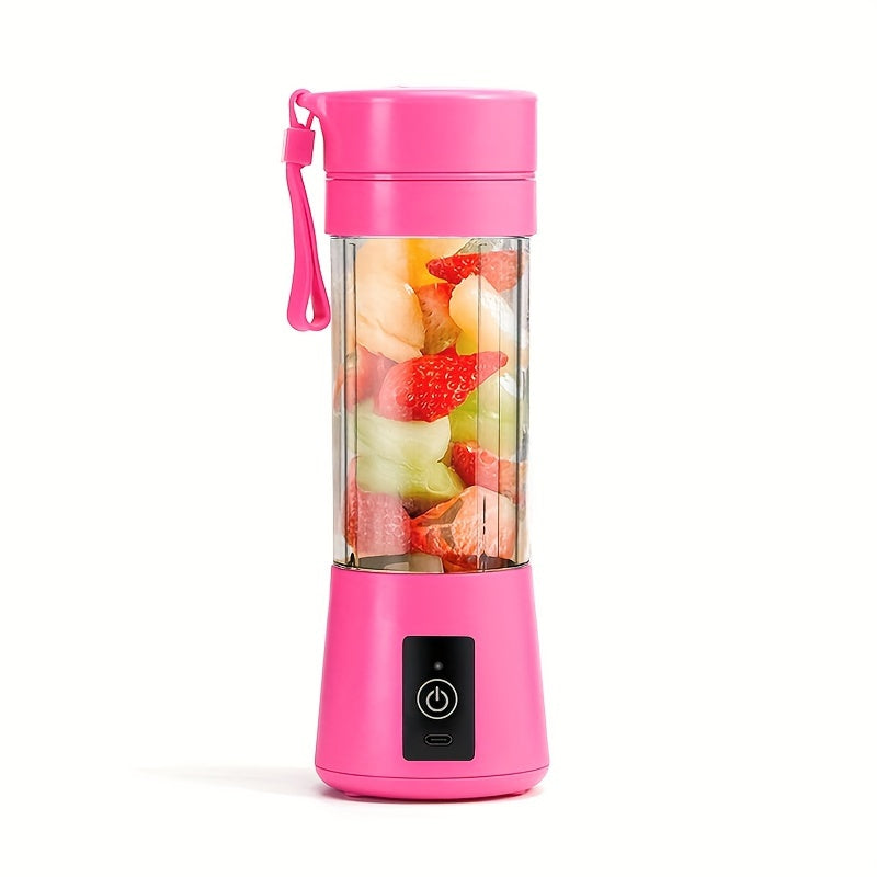 Pink portable blender with fruit inside on a white background