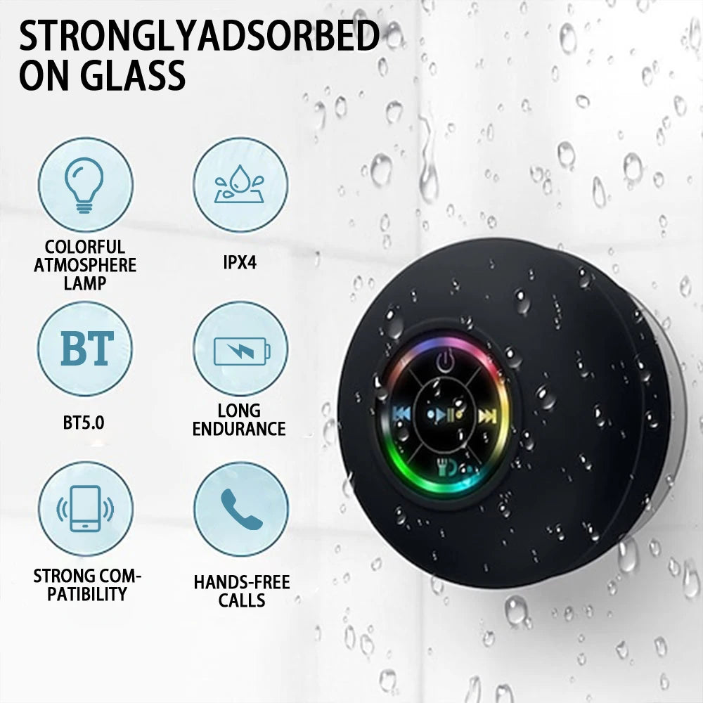 Black shower speaker with features listed on a wet glass background