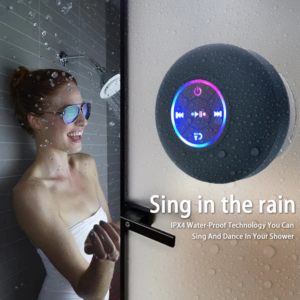 Woman in shower with Bluetooth speaker and text 'Sing in the rain' on a wet surface.