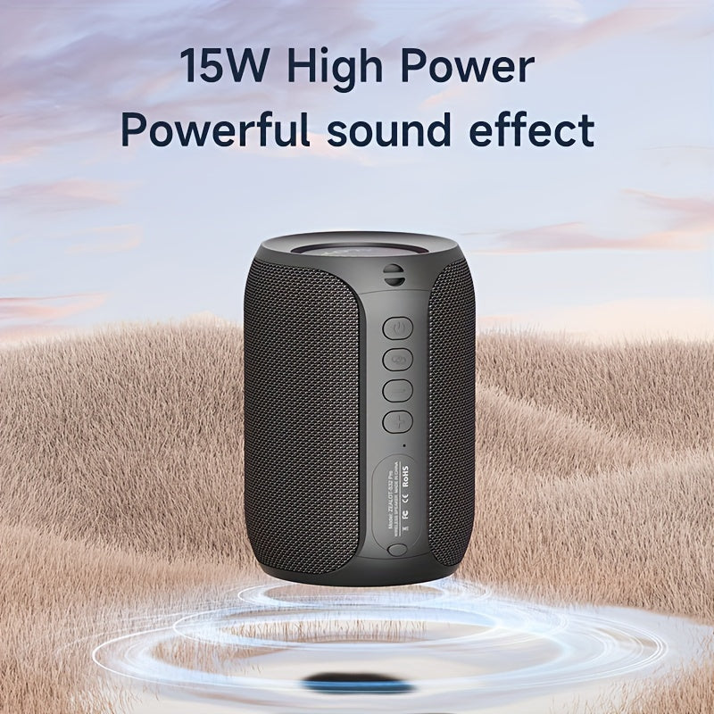 Black portable speaker with '15W High Power Powerful sound effect' text on a desert background
