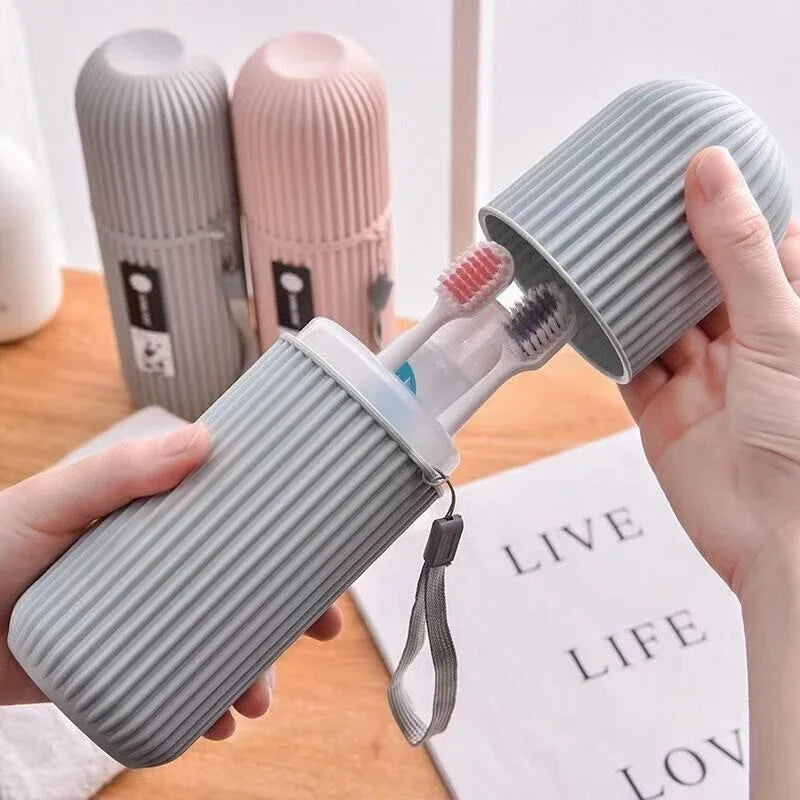 Striped toothbrush holder with toothbrushes on a wooden surface