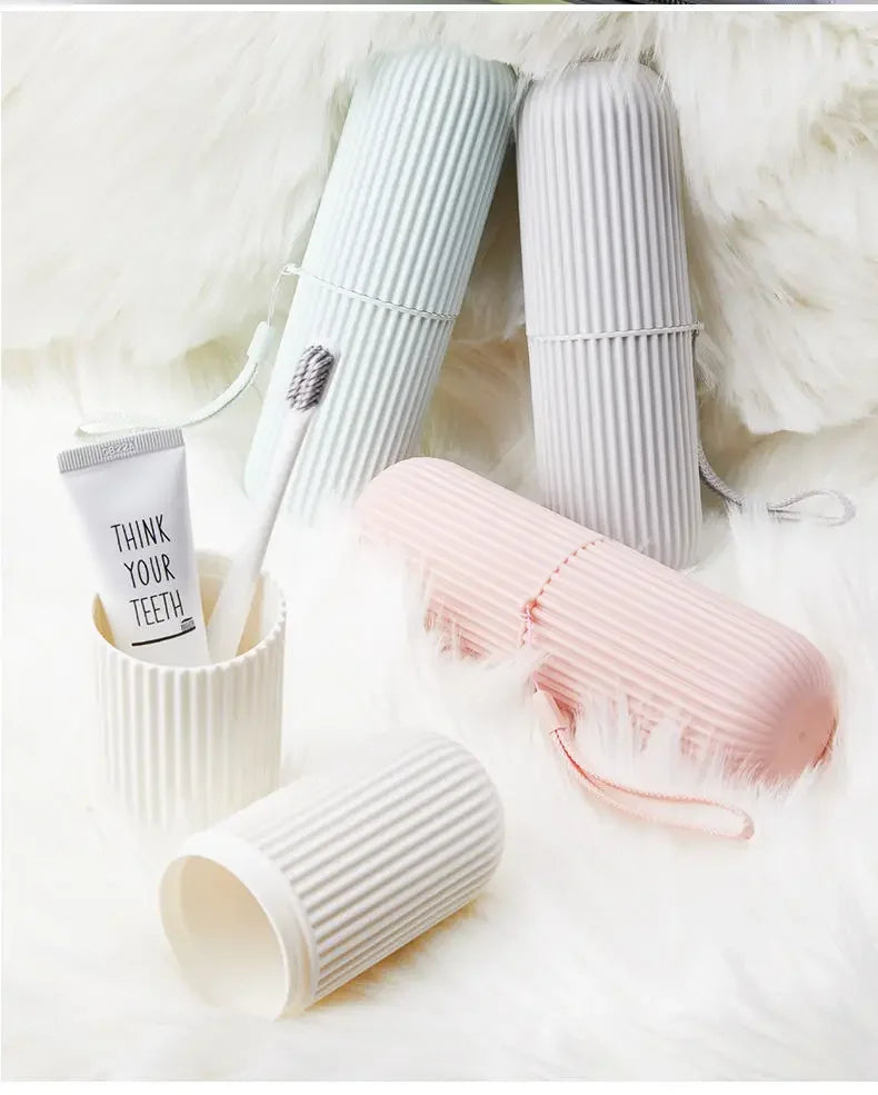 Set of ribbed cups in white, gray, and pink on a soft white background