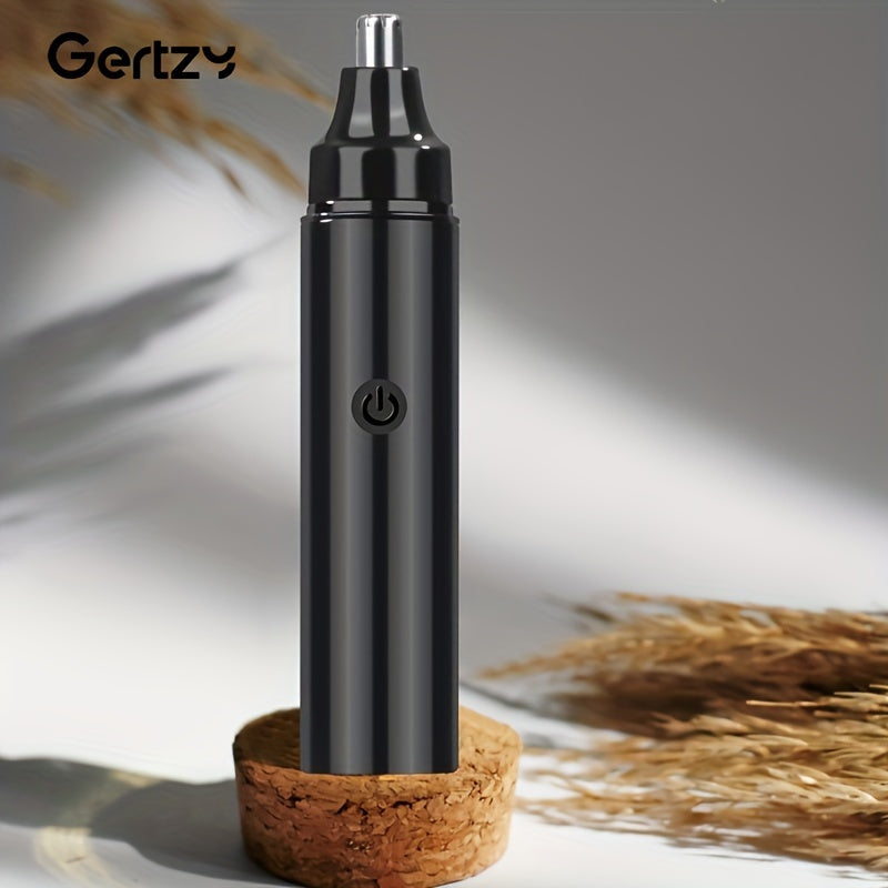 Black electronic device on a cork base with a blurred natural background