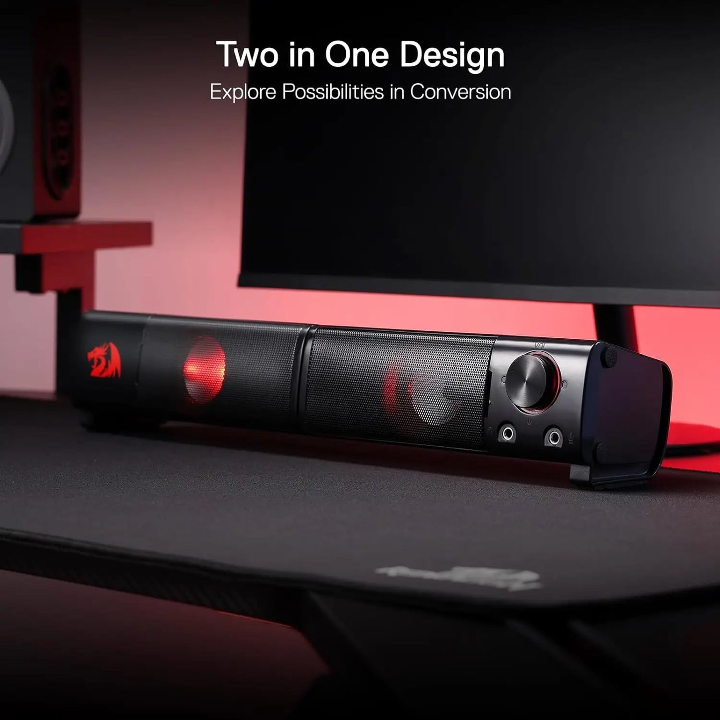 Black electronic device with red accents on a desk, featuring text about a two-in-one design.
