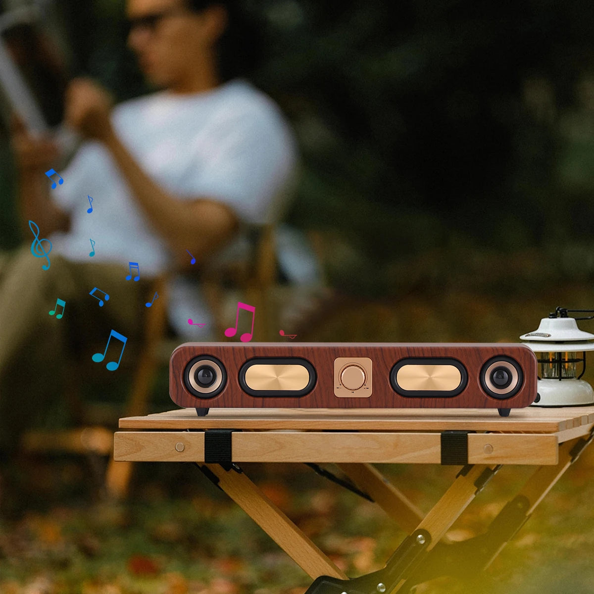 Wooden speaker on a table with a blurred person in the background