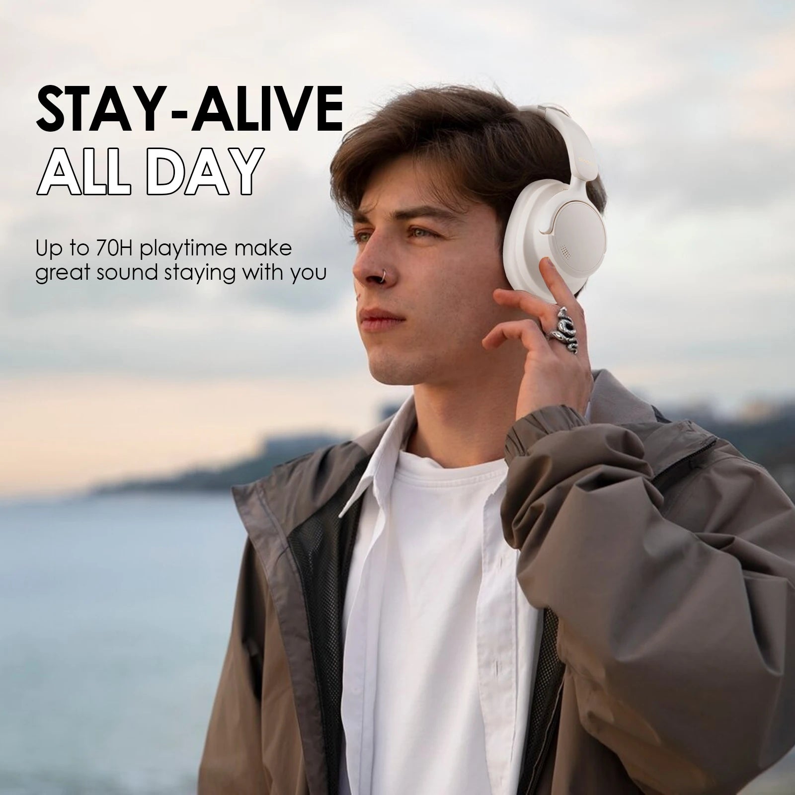 Person wearing headphones with scenic background and promotional text about headphones' playtime.