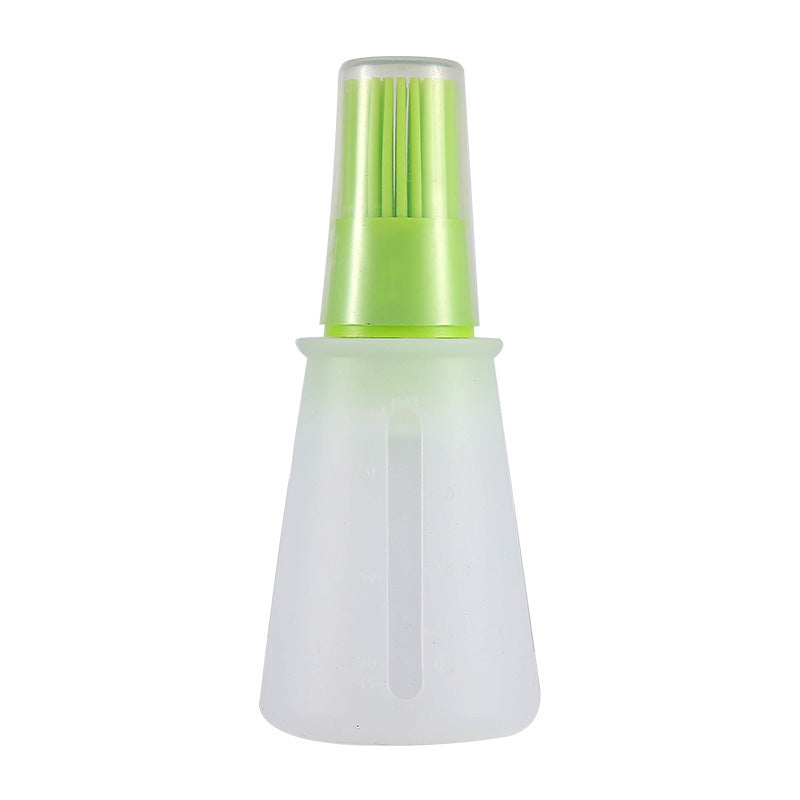 Green and white spray bottle on a white background