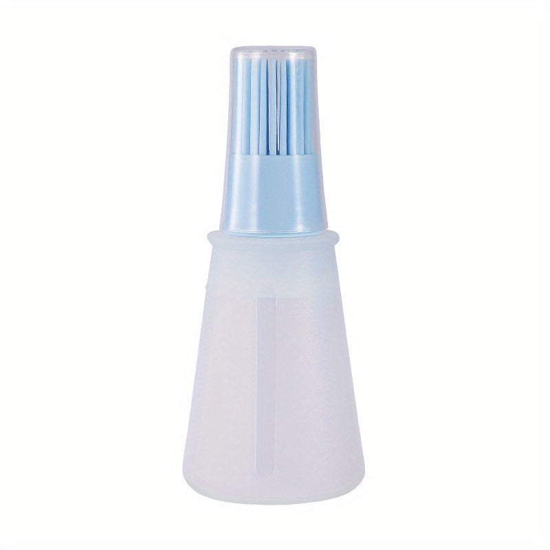 White spray bottle with blue nozzle on a white background