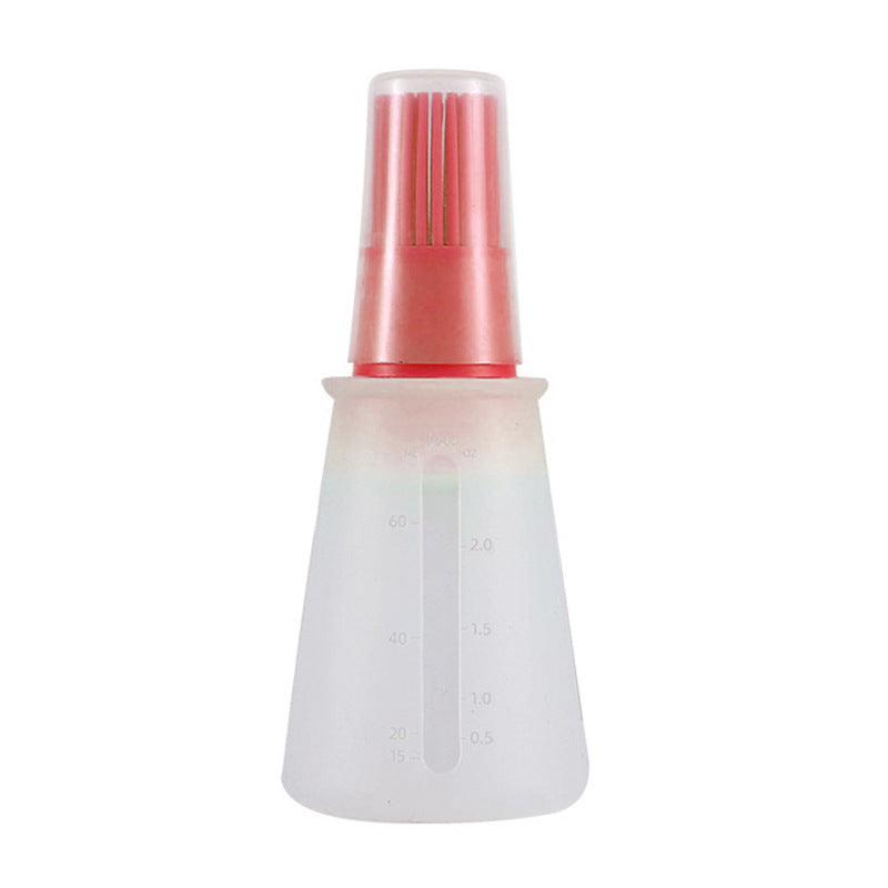 Transparent bottle with a red cap on a white background