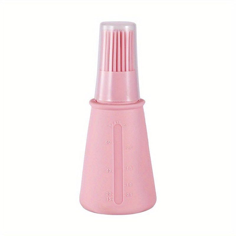 Pink bottle with brush attachment on a white background