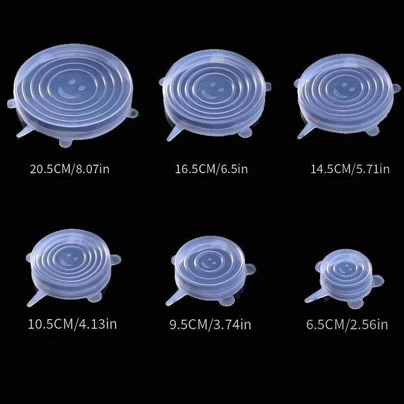 Set of six silicone lids with size indicators on a black background