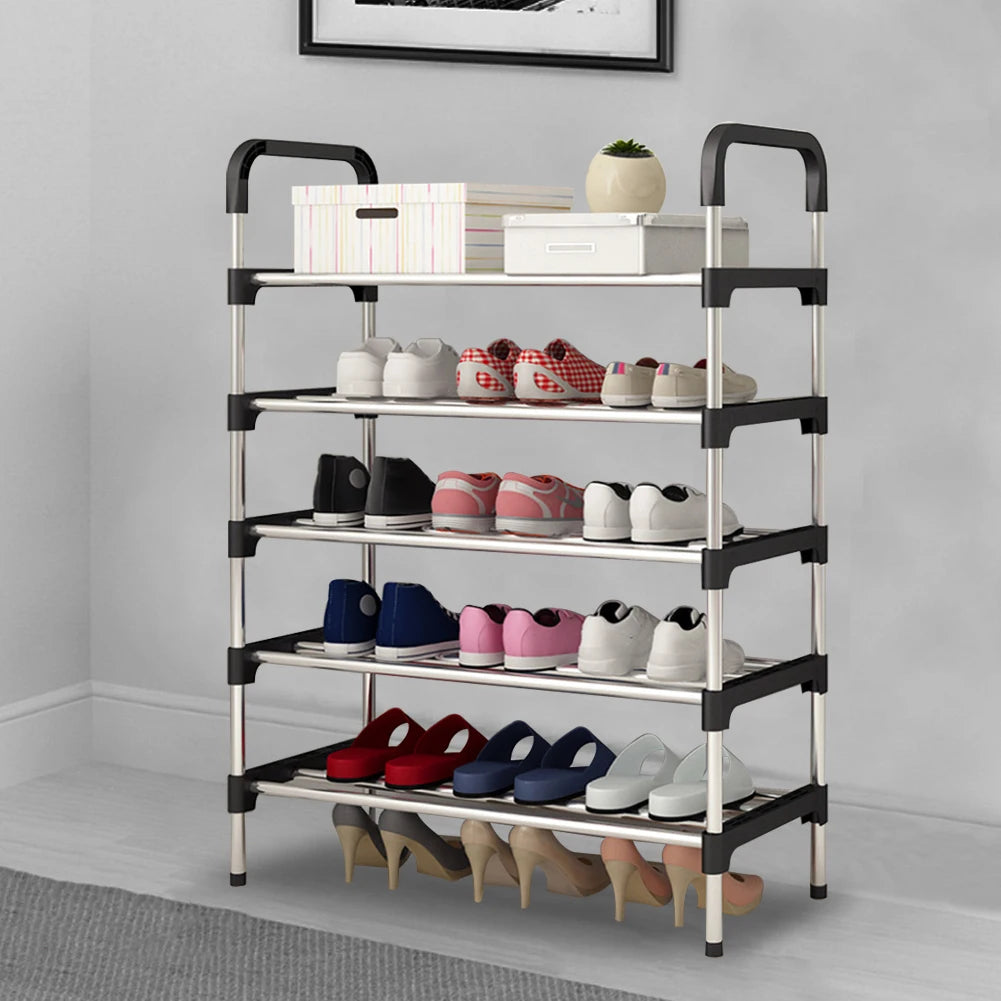 Multi-tiered shoe rack with various shoes on a gray floor against a white wall.