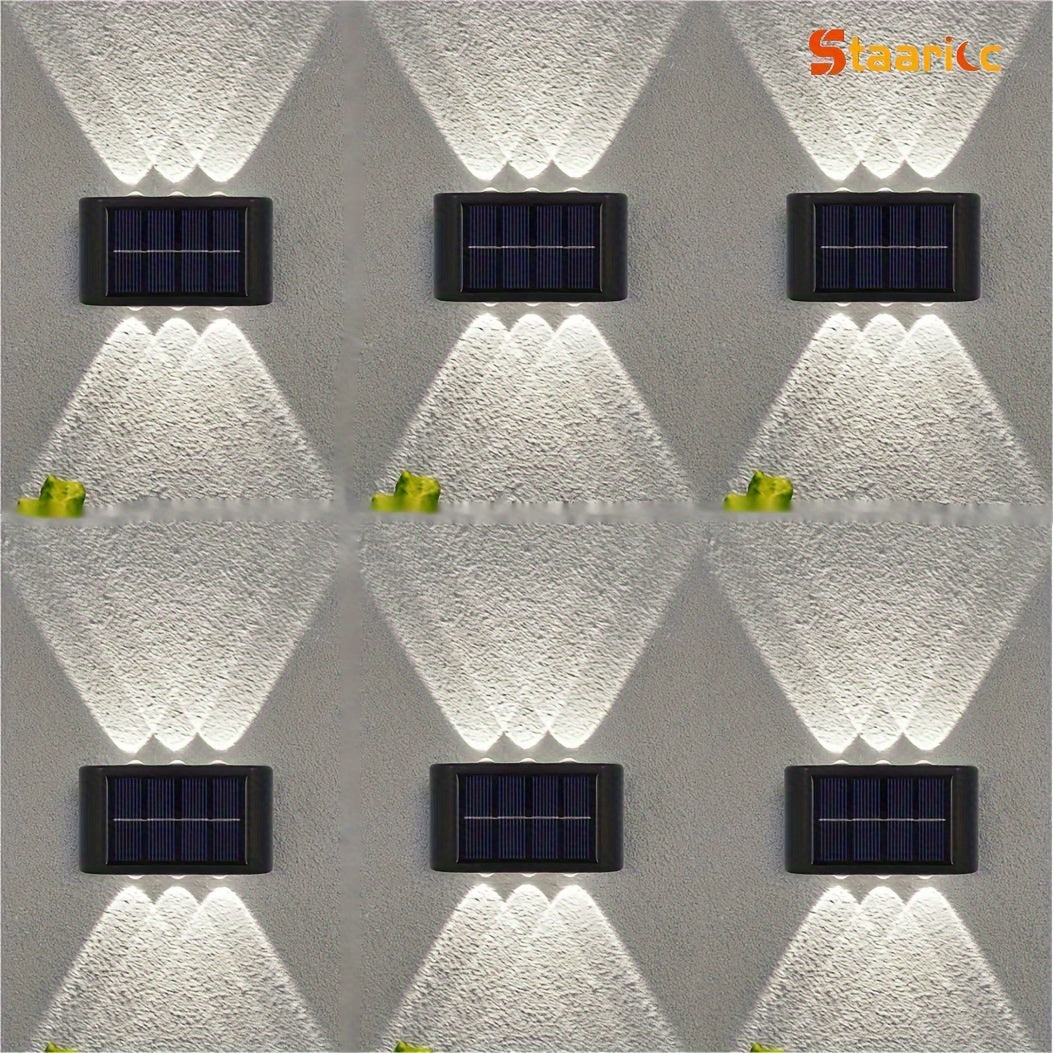Solar wall lights on a textured wall with 'Staanc' branding.