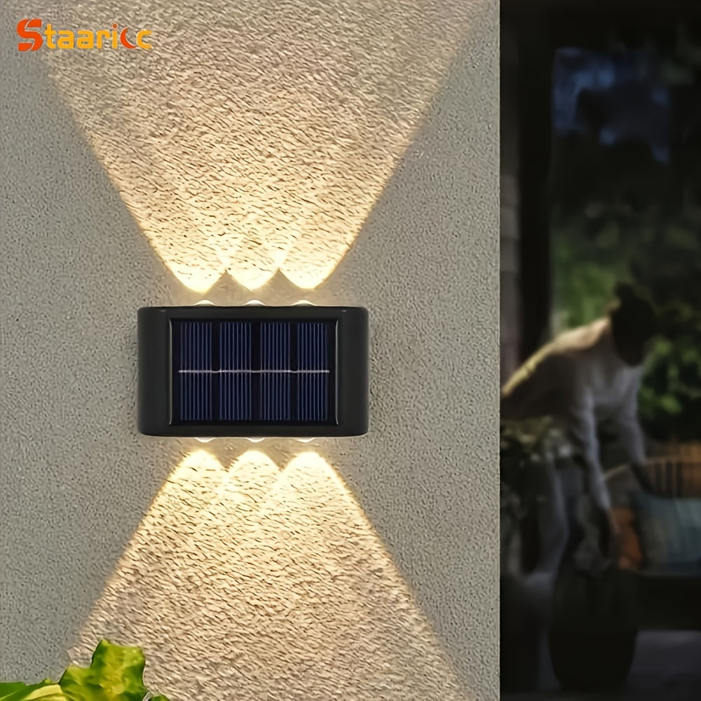 Solar wall light fixture on a textured wall with a blurred background